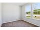 Neutral bedroom with natural light showcasing a view of the neighborhood at 244 Potomac River St, Garner, NC 27529