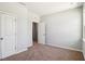 Bedroom with neutral walls and two closets offering ample storage space at 244 Potomac River St, Garner, NC 27529