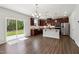 Bright, modern kitchen boasts an island, stainless steel appliances, and a view of the backyard at 244 Potomac River St, Garner, NC 27529
