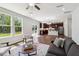 Open-concept living area with hardwood flooring seamlessly connects to the kitchen and dining space at 244 Potomac River St, Garner, NC 27529
