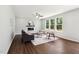 Inviting living room with hardwood floors, modern fireplace, and an abundance of natural light at 244 Potomac River St, Garner, NC 27529