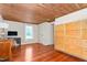 Bedroom featuring wood ceiling and floors, natural light from a window, and a built-in cabinet at 2440 Glencoe St, Burlington, NC 27217