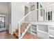 Entryway featuring wood stairs and tile flooring, an overhead view of the space, and white walls at 2440 Glencoe St, Burlington, NC 27217