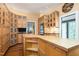 Spacious kitchen featuring light wood cabinetry, an island, stainless appliances, and hardwood flooring at 2440 Glencoe St, Burlington, NC 27217