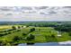 Expansive aerial view of a charming home surrounded by picturesque countryside and mature trees at 2912 Epps Clark Rd, Siler City, NC 27344
