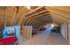Spacious unfinished attic with exposed wooden beams, offering ample storage space at 2912 Epps Clark Rd, Siler City, NC 27344