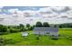 Spacious backyard with a storage shed, play set and trampoline, perfect for outdoor activities at 2912 Epps Clark Rd, Siler City, NC 27344