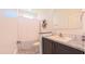 Bathroom featuring dark vanity with marble counters and shower with curtain at 2912 Epps Clark Rd, Siler City, NC 27344