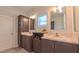 Bathroom with double sinks, updated fixtures, cabinets, and a marble-topped counter at 2912 Epps Clark Rd, Siler City, NC 27344