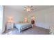 Well-lit bedroom features a view of a connected bathroom and modern furnishings at 2912 Epps Clark Rd, Siler City, NC 27344