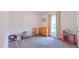Cozy bedroom with natural light, carpet, and simple furniture at 2912 Epps Clark Rd, Siler City, NC 27344
