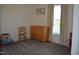 Neutral bedroom with a wooden changing table and ample natural light from the window at 2912 Epps Clark Rd, Siler City, NC 27344