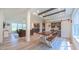 Open-concept dining area with modern fixtures, wood floors, and seamless flow to other living spaces at 2912 Epps Clark Rd, Siler City, NC 27344