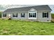 Charming single-story home features gray siding, black shutters, and a well-maintained green lawn at 2912 Epps Clark Rd, Siler City, NC 27344