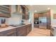Gourmet kitchen with custom cabinetry, stainless steel appliances, and marble countertops at 2912 Epps Clark Rd, Siler City, NC 27344
