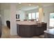 Stylish kitchen featuring custom cabinets, stainless steel sink, and open layout to the dining area at 2912 Epps Clark Rd, Siler City, NC 27344