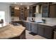 A kitchen featuring custom cabinets, stainless steel appliances, and marble countertops at 2912 Epps Clark Rd, Siler City, NC 27344