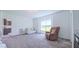 Cozy living room with soft carpet, comfortable sofa, and window views at 2912 Epps Clark Rd, Siler City, NC 27344