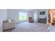 Bright, spacious living room features large window, soft carpet, and comfortable seating at 2912 Epps Clark Rd, Siler City, NC 27344