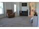 Spacious living room features plush carpet, a cozy recliner, and built-in cabinets at 2912 Epps Clark Rd, Siler City, NC 27344