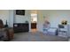 Bright living room with neutral decor, built-in shelves, and an open view to the kitchen at 2912 Epps Clark Rd, Siler City, NC 27344