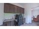 Home office featuring custom cabinetry, granite counters, carpet, and a modern computer at 2912 Epps Clark Rd, Siler City, NC 27344