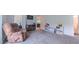 Bright play room with neutral walls, plush carpet, and comfortable armchair at 2912 Epps Clark Rd, Siler City, NC 27344