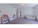 Bright play room with neutral walls, plush carpet, and ample space for activities at 2912 Epps Clark Rd, Siler City, NC 27344