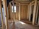 Framed interior with wood beams and studs, showing open layout and construction at 3006 Dog Rose Dr # 308, Durham, NC 27703