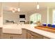 Open-concept living area with a kitchen island and stainless steel dishwasher at 3006 Dog Rose Dr # 308, Durham, NC 27703