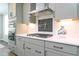 Modern kitchen featuring a gas cooktop, stainless steel appliances, and gray cabinetry at 3006 Dog Rose Dr # 308, Durham, NC 27703
