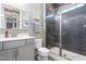 Modern bathroom features a glass-enclosed shower, stylish vanity, and sleek finishes at 345 Warm Wind Dr, Clayton, NC 27527