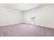 Bedroom has neutral carpet with a single double hung window providing natural light at 345 Warm Wind Dr, Clayton, NC 27527