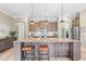 Open kitchen with granite countertops, stainless steel appliances, and a breakfast bar with seating at 345 Warm Wind Dr, Clayton, NC 27527