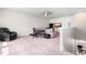 Living room with ceiling fan, media cabinet and desk with pull-out sofa at 345 Warm Wind Dr, Clayton, NC 27527
