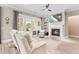 Living room features a fireplace, ceiling fan, and sliding doors to an outdoor patio at 345 Warm Wind Dr, Clayton, NC 27527