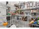 Organized pantry with wire shelving stocked with food items, jars, and containers at 345 Warm Wind Dr, Clayton, NC 27527