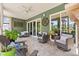 Outdoor seating area with ceiling fan and slider glass doors to backyard at 345 Warm Wind Dr, Clayton, NC 27527