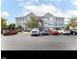 Apartment building featuring plentiful parking and a well-maintained exterior at 3489 Forestdale Dr # 2D, Burlington, NC 27215