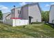 View of the backyard featuring a privacy fence, grass, and a back entrance at 368 Bayleigh Ct, Garner, NC 27529