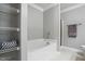 Relaxing bathroom features a soaking tub, shower and lots of storage shelves at 368 Bayleigh Ct, Garner, NC 27529