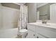 Clean bathroom features a shower-tub combo, white vanity, and a decorative shower curtain at 368 Bayleigh Ct, Garner, NC 27529