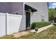 Inviting front entrance with a black door, gray siding and manicured landscaping at 368 Bayleigh Ct, Garner, NC 27529