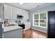 Bright kitchen showcasing white cabinets, stainless steel appliances, and a view of the outside at 368 Bayleigh Ct, Garner, NC 27529