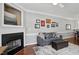 Cozy living room with a fireplace, comfortable seating, and hardwood floors at 368 Bayleigh Ct, Garner, NC 27529