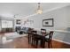 Open concept living and dining area with hardwood floors, a fireplace, and comfortable seating at 368 Bayleigh Ct, Garner, NC 27529