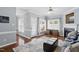 Spacious living room featuring hardwood floors, a fireplace, and plenty of natural light at 368 Bayleigh Ct, Garner, NC 27529