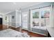 Bright living room with large windows, a glass door, and hardwood floors at 368 Bayleigh Ct, Garner, NC 27529