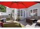 Outdoor patio area featuring comfortable seating, artificial grass and shade umbrella at 368 Bayleigh Ct, Garner, NC 27529