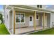Covered back porch, with white trim and brown support posts at 408 W Stallings St, Clayton, NC 27520
